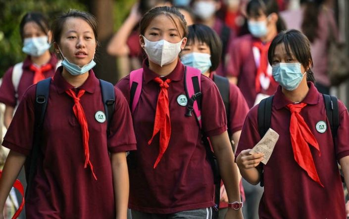 China has passed a new law to limit the pressure on children from homework and after-school tutoring Hector RETAMAL AFP